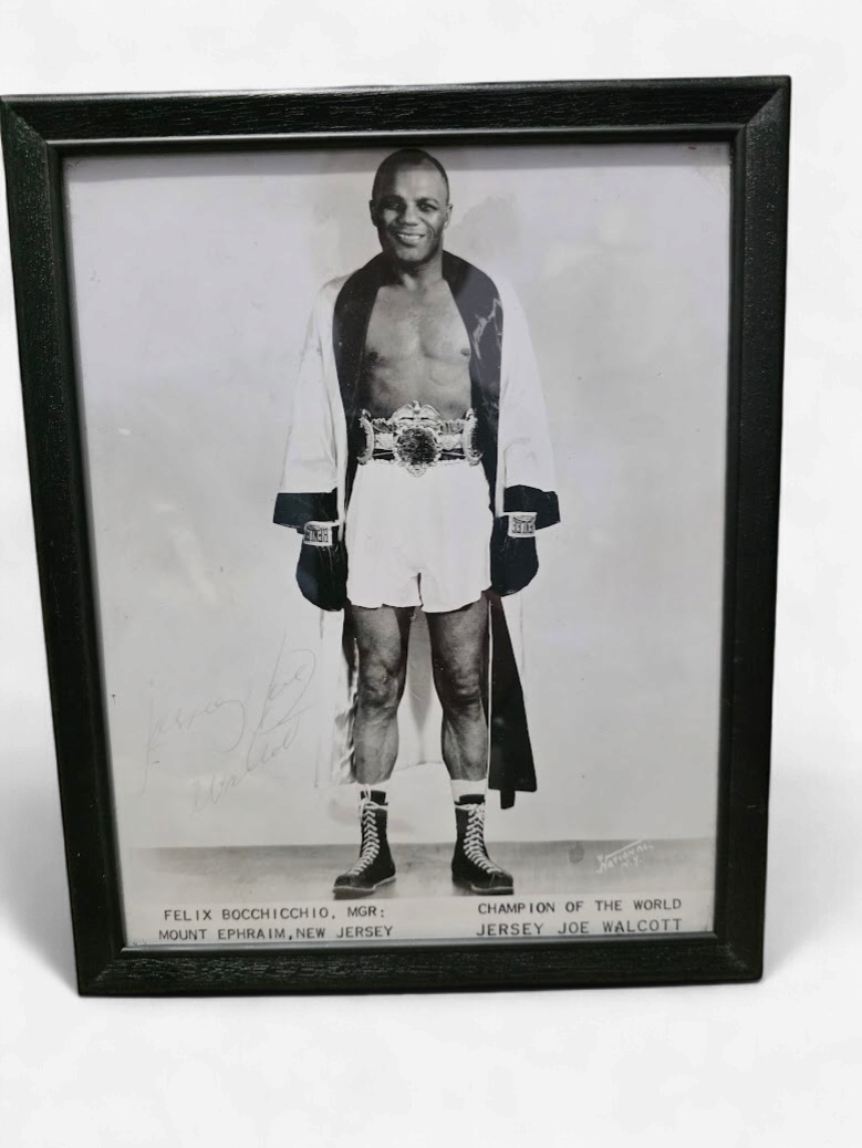 Jersey Joe Walcott, photographed while wearing the Heavyweight Championship belt. Auto