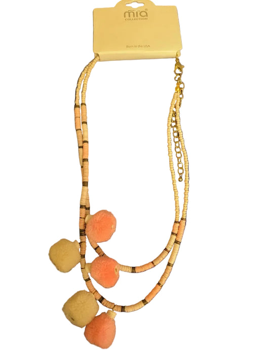 Mia Collection peach and cream beaded necklace featuring pom-poms